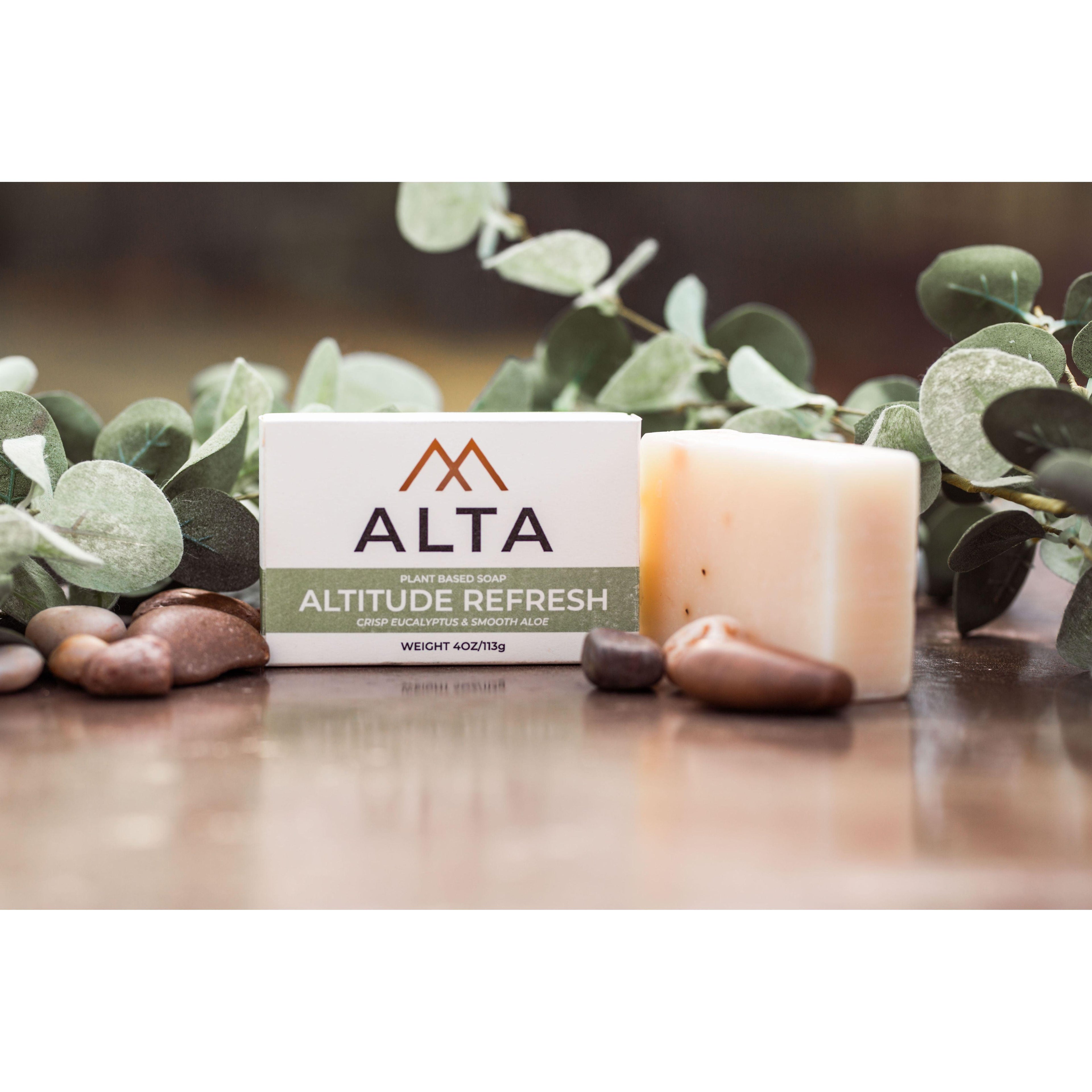 Altitude Refresh natural bar soap by Alta Body. A green and white cold-process soap bar featuring eucalyptus, aloe vera, and peppermint leaves.