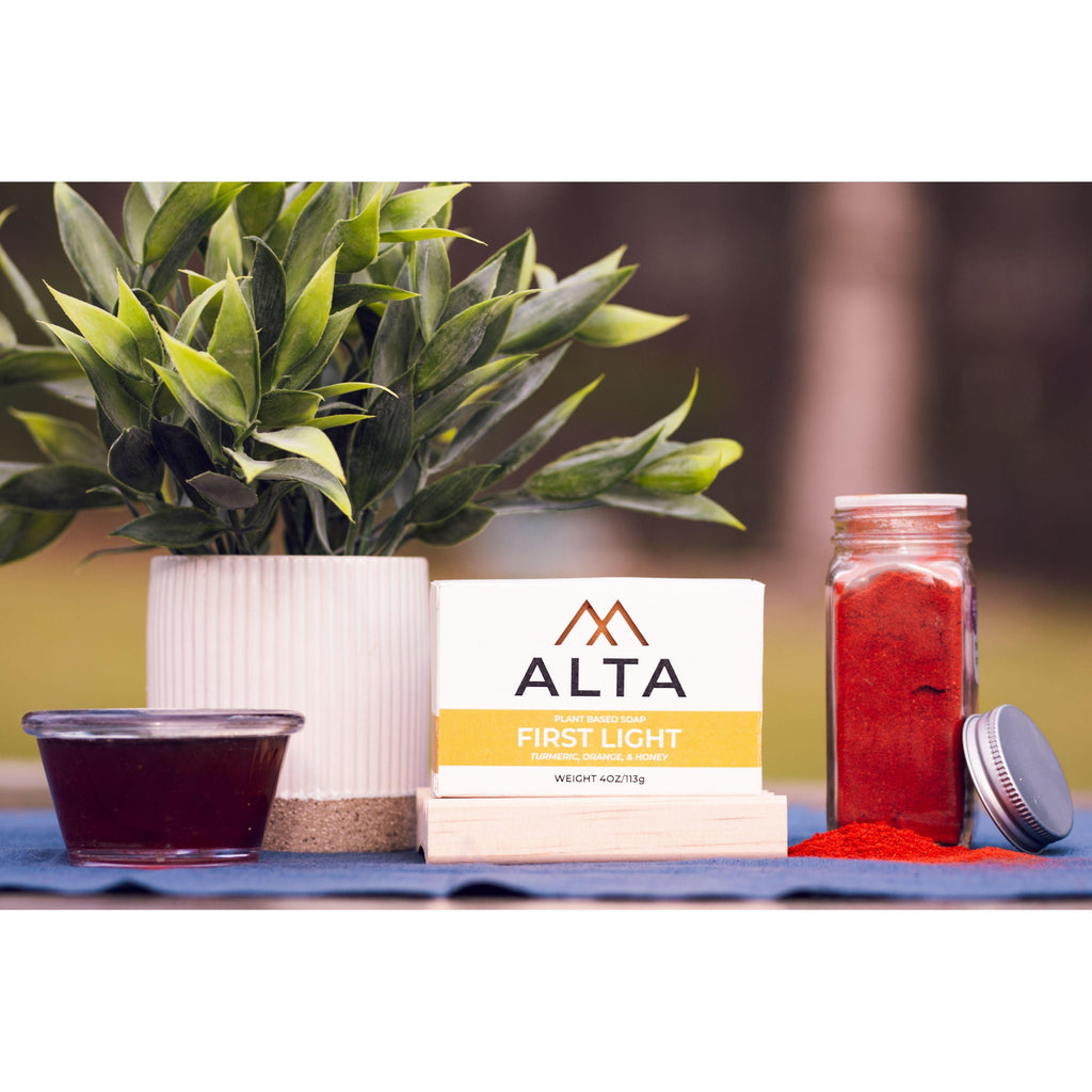 First Light natural bar soap by Alta Body, featuring orange, turmeric, and honey ingredients in a 4.5oz cold-process bar.