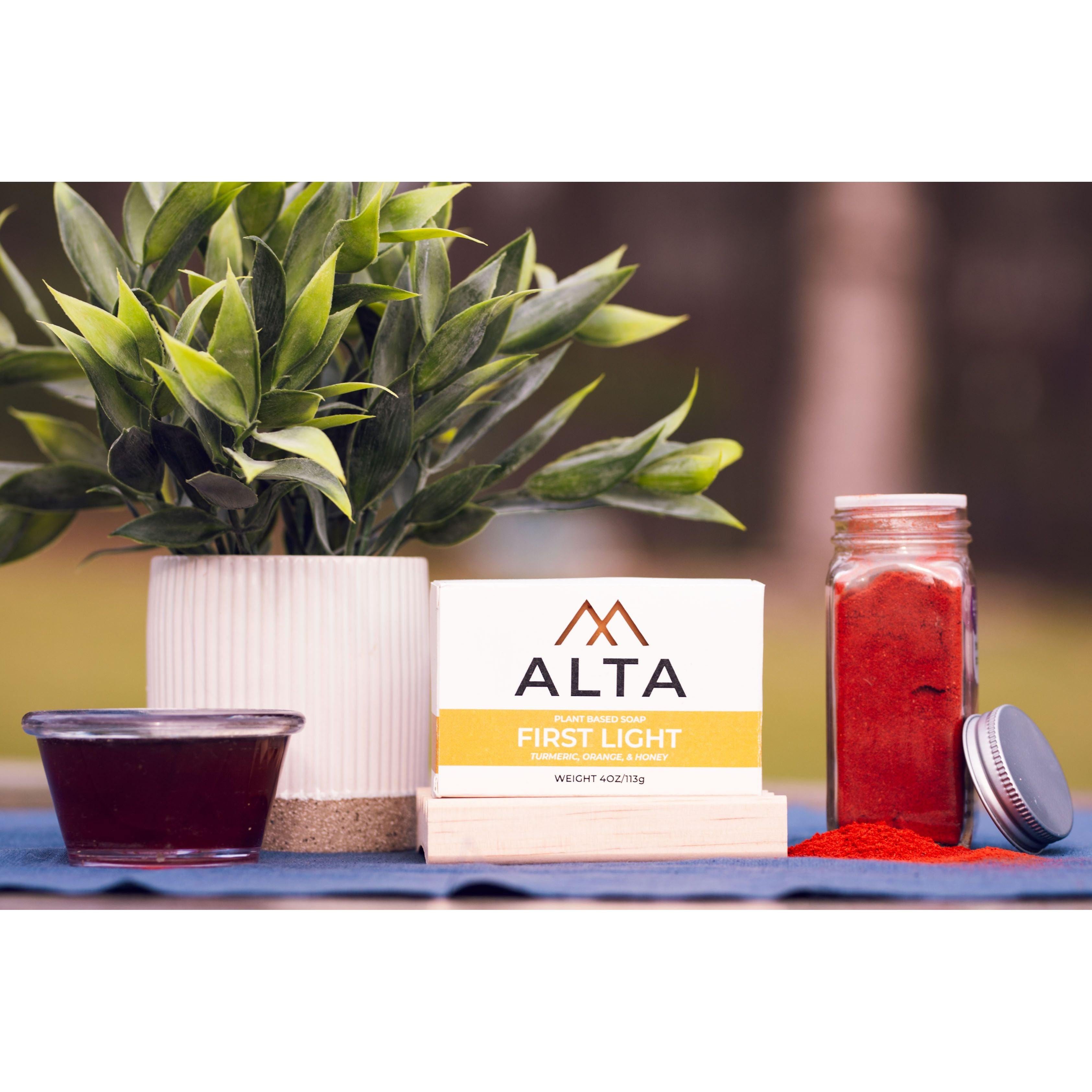 First Light natural bar soap by Alta Body, featuring orange, turmeric, and honey ingredients in a 4.5oz cold-process bar.