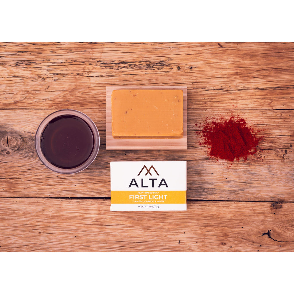 First Light natural bar soap by Alta Body, featuring orange, turmeric, and honey ingredients in a 4.5oz cold-process bar.