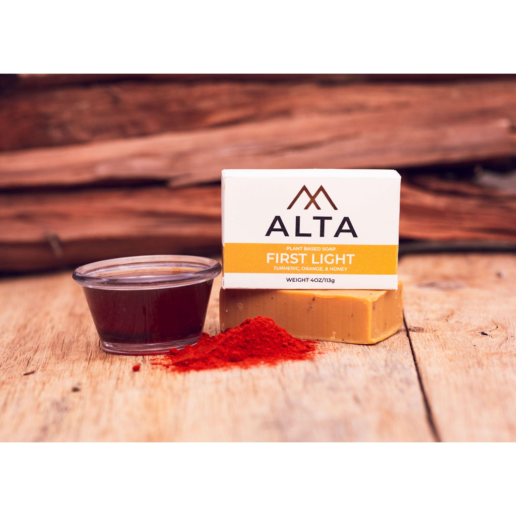 First Light natural bar soap by Alta Body, featuring orange, turmeric, and honey ingredients in a 4.5oz cold-process bar.