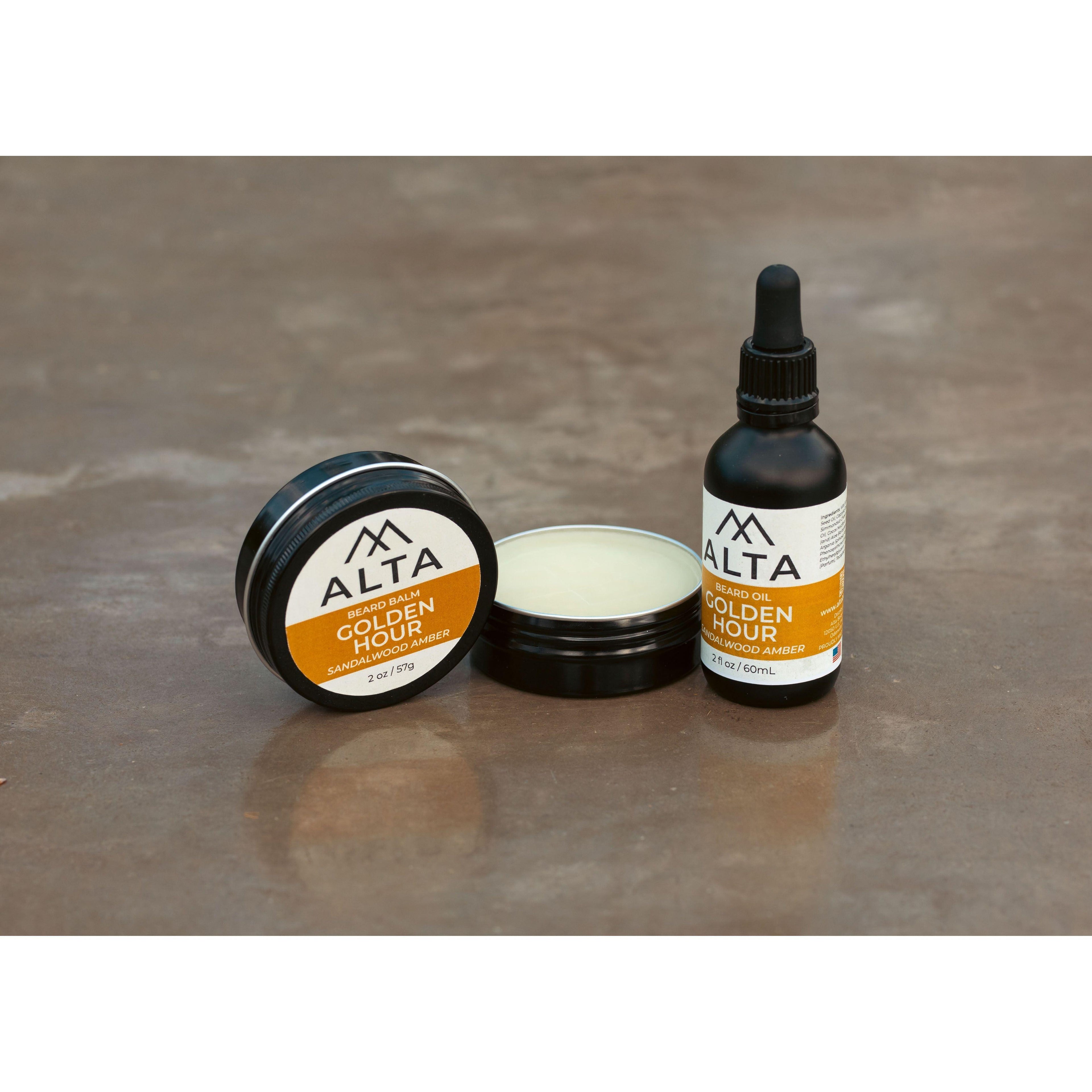 Alta Body Golden Hour Premium Beard Balm in a black 2oz tin. Sandalwood and Amber scented beard styling balm with Matcha Tea Butter.