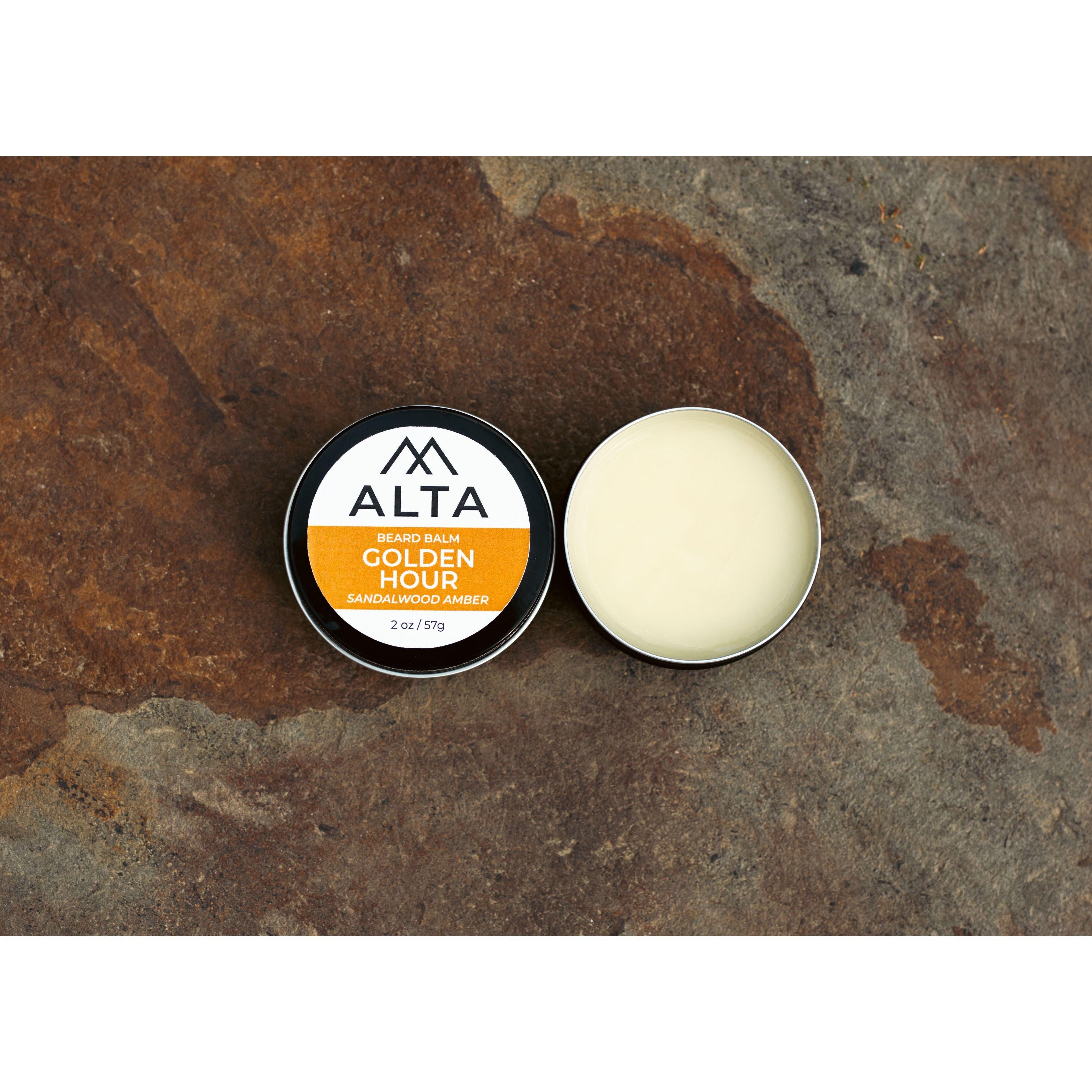 Alta Body Golden Hour Premium Beard Balm in a black 2oz tin. Sandalwood and Amber scented beard styling balm with Matcha Tea Butter.