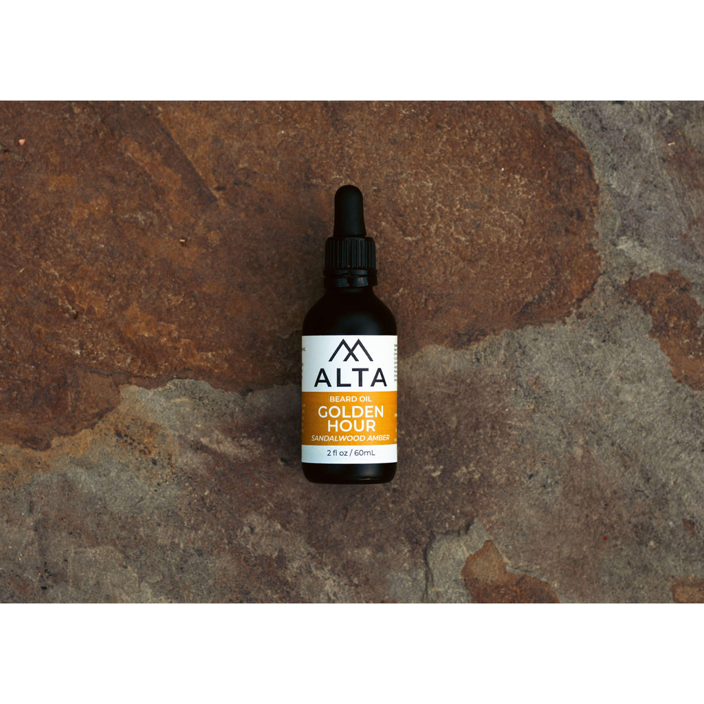 Alta Body Golden Hour Premium Beard Oil in a 2oz glass dropper bottle. Sandalwood and Amber scented natural beard conditioner.