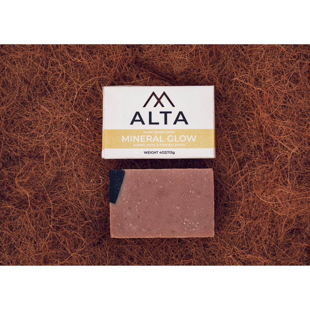 Alta Body Mineral Glow natural bar soap. A dark, textured Dead Sea mud and activated charcoal exfoliating cold-process soap bar.