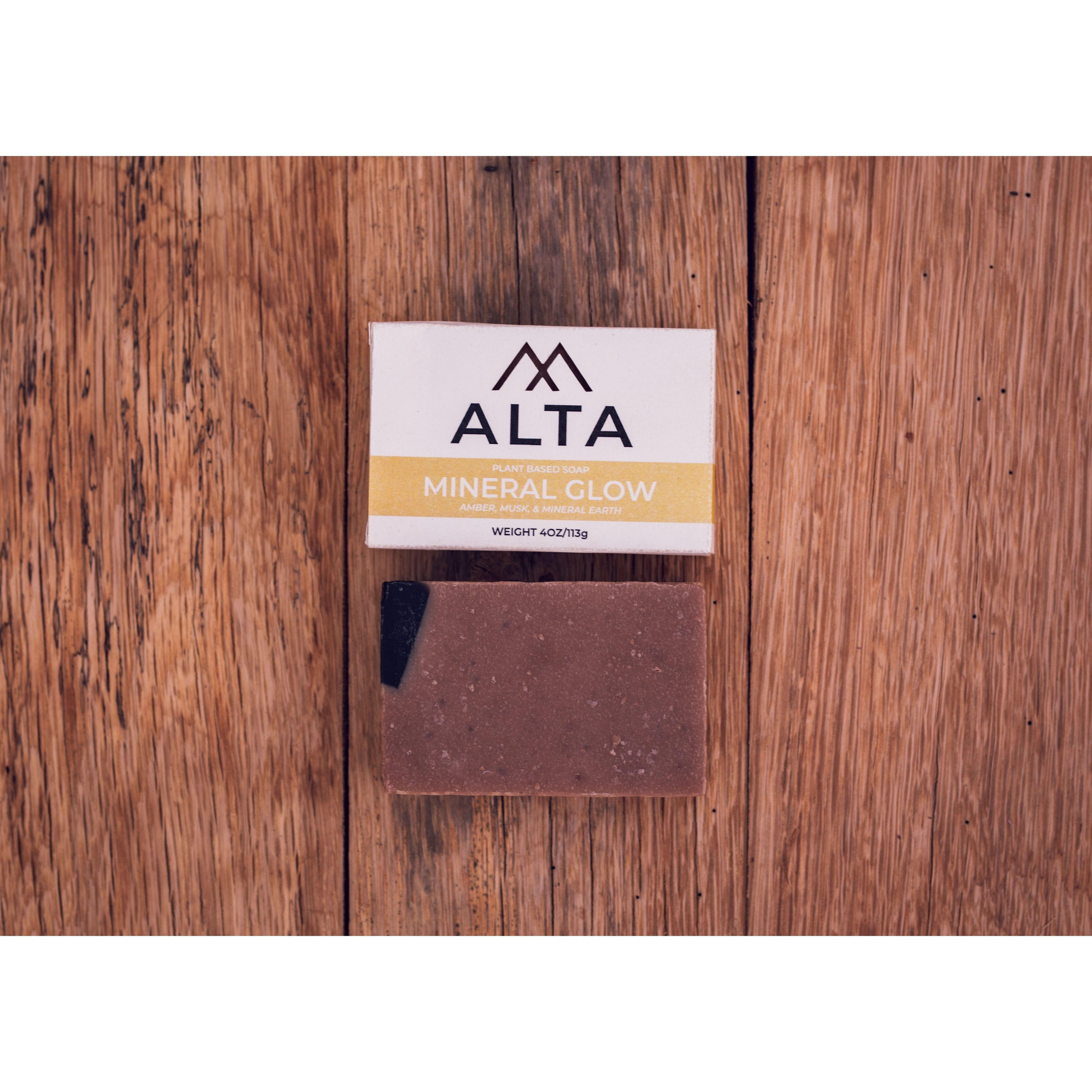 Alta Body Mineral Glow natural bar soap. A dark, textured Dead Sea mud and activated charcoal exfoliating cold-process soap bar.