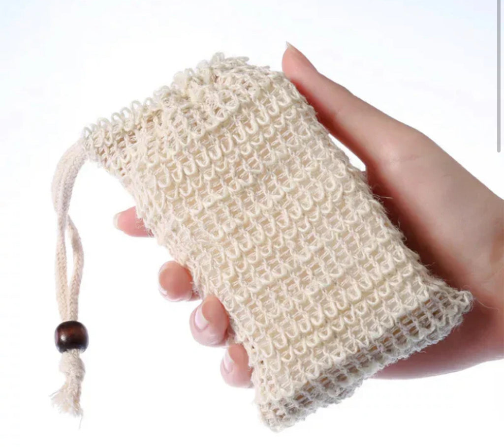 Close-up of a natural beige ALTA Bar Sleeve showing the woven sisal mesh texture and adjustable drawstring with a dark wooden bead.